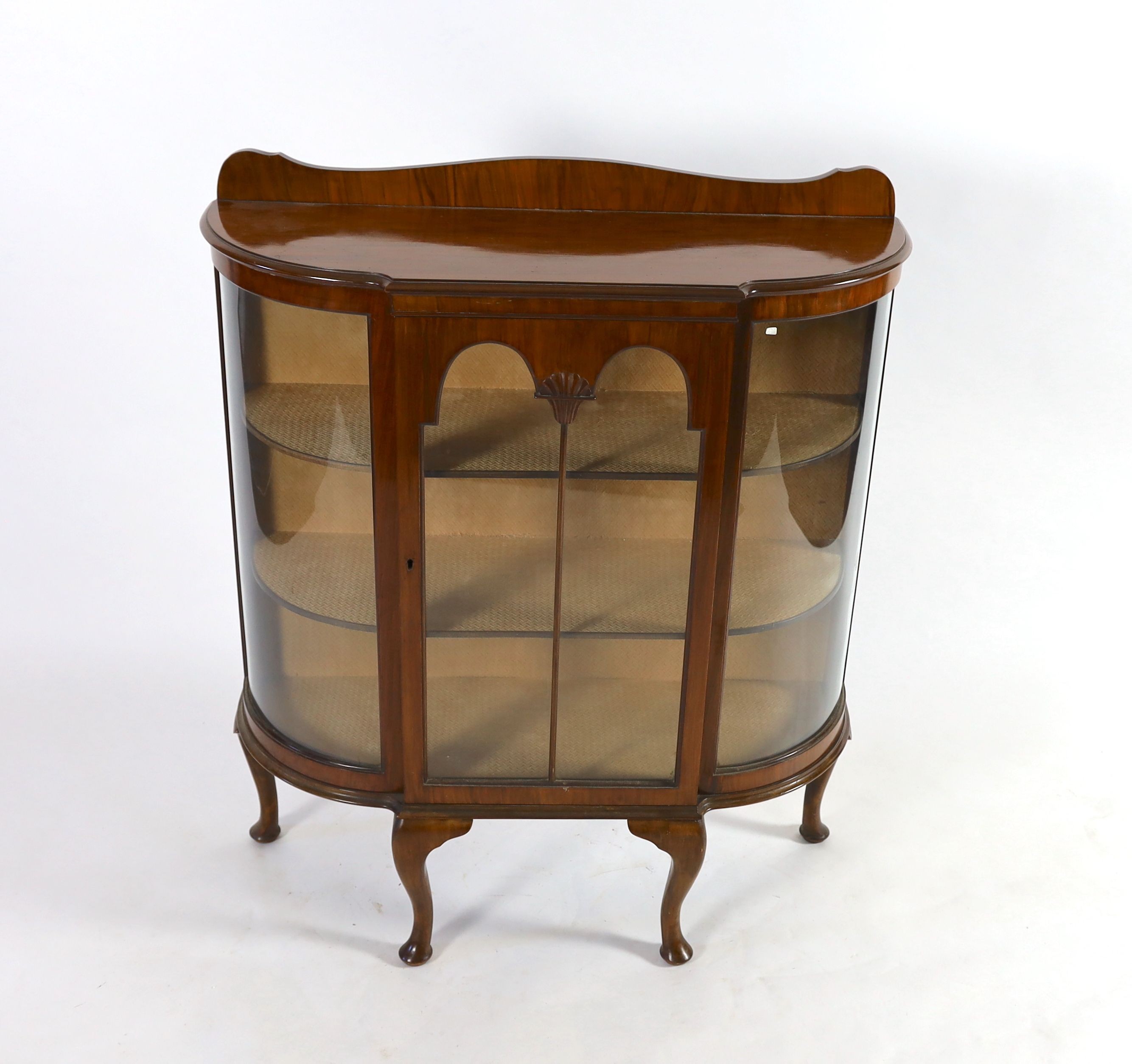 An early 20th century walnut bowfront display cabinet, width 106cm depth 38cm height 126cm